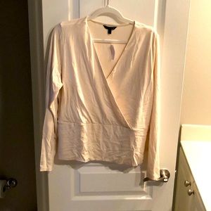 Banana Republic. Cream shirt perfect for high waisted jeans. Never worn.